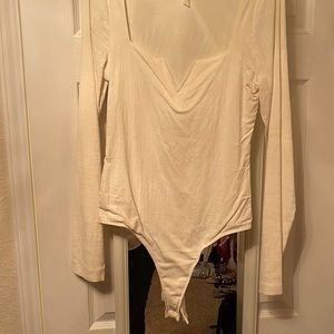 Free People Bodysuit - Never Worn. Beige with sexy V.